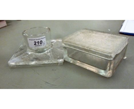 Lalique glass: to include a box with floral ornament  2''h  4''w; and a tea light holder  4.5''sq  both bearing etched signat