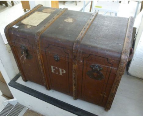 An early 20thC canvas clad trunk with stained beech bracket supports and metal clasps  22''h  31''w        BSR