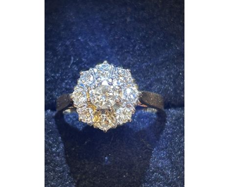18ct Gold ring set with 9 diamonds inscribed 18ct DB817 Size K Weight 2.4g 