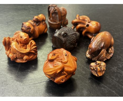 Collection of eight finely carved wooden netsuke figures, unsigned