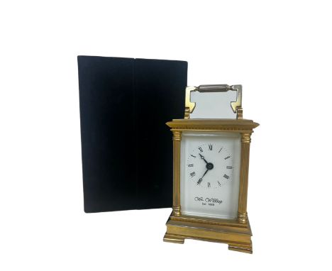 William Widdop heavy brass carriage clock with original plush case and key, currently ticking 