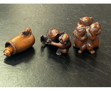 Three finely carved wooden netsuke, all signed 