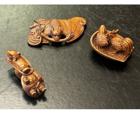 Three finely carved wooden netsuke figures, all signed