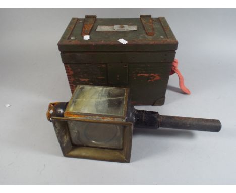 A Trap Lamp and Ammunition Box. 