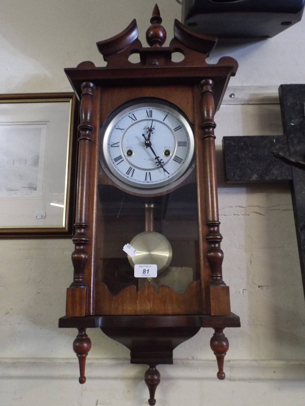 A Modern Mahogany Cased Wall Clock by Lincoln with 31 Day Movement.