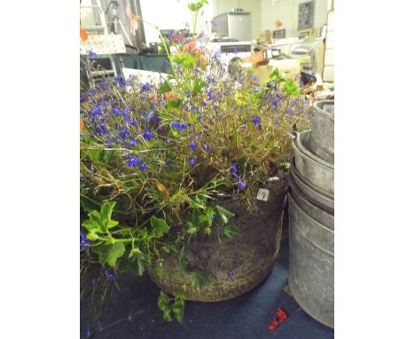 A Circular Stone Planter. 