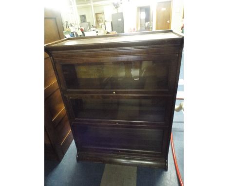 A Three Section Globe Wernicke Style Bookcase on Plinth Base. 86.5x36x113cm High