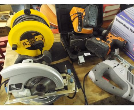 A Collection of Three Power Tools Circular Saw Jigsaw Hand Drill and Battery Pack and An Extension Cable. 