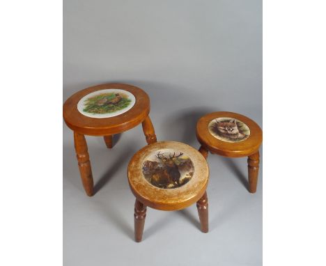 Three Circular Topped Three Legged Stools with Ceramic Sporting Inset Tops. 