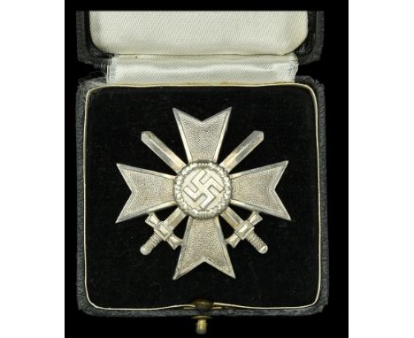 A German Second War War Service Cross First Class with Swords. A magnificent example of a domed construction War Service Cros