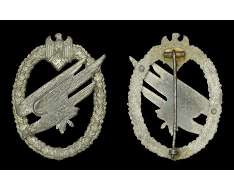 A German Second War Army Paratrooper Badge. A late war production of the Army Paratrooper badge in zinc with sheet metal hing