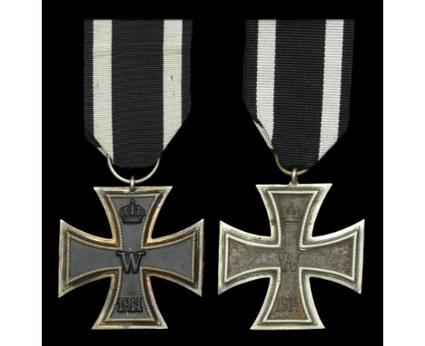 Two German Great War Iron Crosses Second Class. The first with larger than normal size ring that is stamped with crescent and