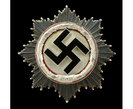 A German Second War German Cross in Silver. An absolutely magnificent example of the Deschler produced heavy version of the G