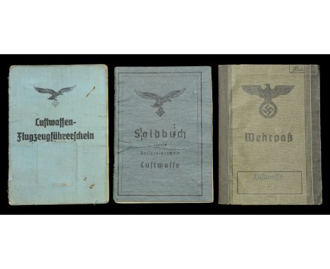 A German Second War Luftwaffe Pilots Soldbuch, Wherpass, and License. A nice grouping comprising the Luftwaffe soldbuch in bl