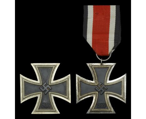 Two German Second War Iron Crosses. A good clean Iron Cross First Class, maker marked to the pin L15 (Otto Schickle of Pforzh