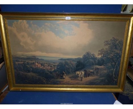 A large framed print on board of travellers on a country lane with a coastal town in the valley and the sea in the distance, 