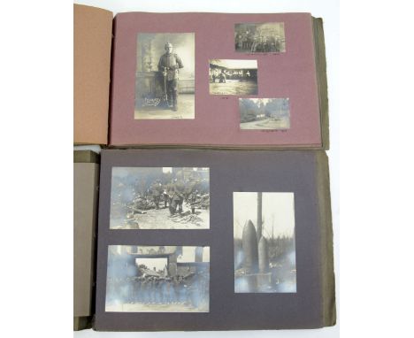 Imperial German Photograph Album Pair, the albums consist of snapshot photographs and postcards. The first album starts with 
