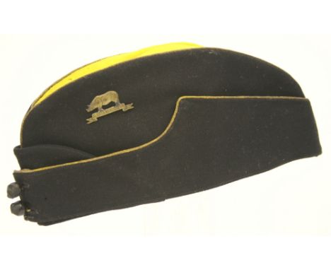 Indian Army Assam Regiment Officers Field Service Cap, of black cloth body with yellow top. Gold bullion braid border to the 