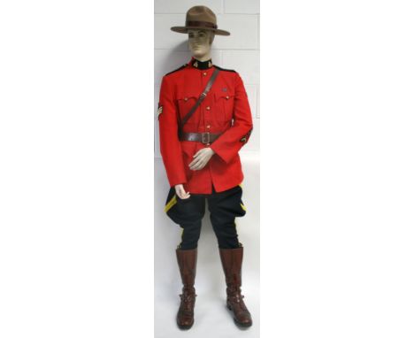 Royal Canadian Mounted Police (RCMP) Full Uniform consisting of red tunic with gilt metal queens crown collar badges and bras