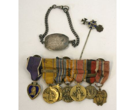 WW2 American Purple Heart Miniature Medal Group of Seven, mounted onto a medal bar. Group consists of Purple Heart, American 