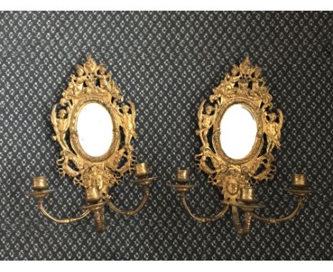 Three branch gilded wall mounted triple candlestick holders with mirror.