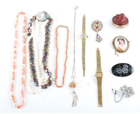 A collection of various jewellery to include two strings of coral beads, a triple string of pearls, a clarified amber necklac