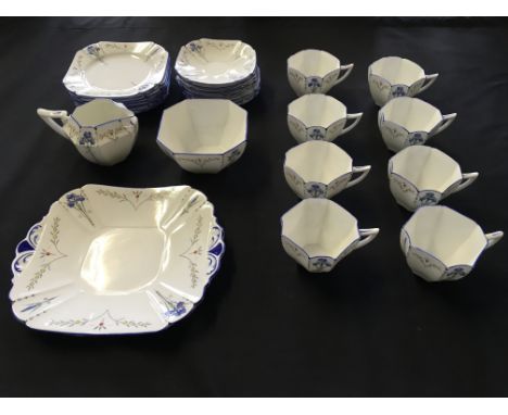 A Shelley Iris design tea service including eight cups, saucers and side plates, with a milk jug, sugar bowl and plate.