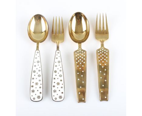 A lot to include two Danish silver gilt and enamel fork and spoon sets by A. Michelsen, one set with white dot pattern, rever