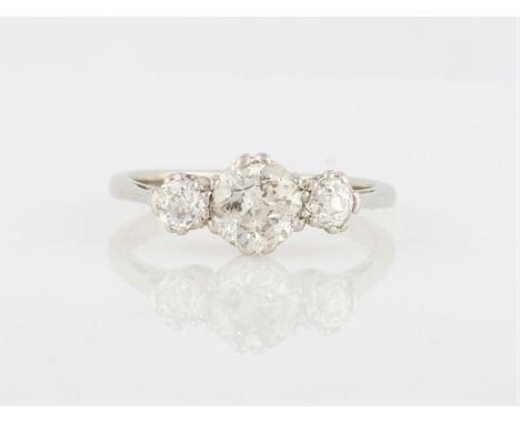 A three stone diamond ring, set with three graduated round cut diamonds, the central diamond being a round brilliant cut and 