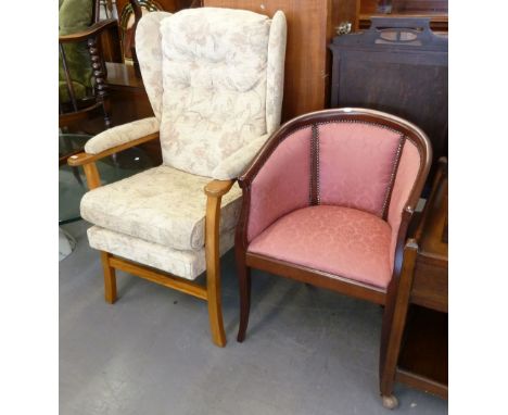 STUART JAMES MODERN MAHOGANY FRAMED TUB SHAPED EASY ARMCHAIR, UPHOLSTERED AND COVERED IN WINE RED DAMASK AND A WINGED FIRESID