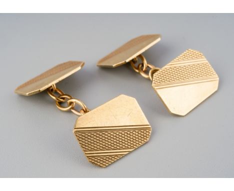 A pair of mid 20th century 9ct gold cufflinks, The rectangular shape links with engine turned detail, connected by chains, ha