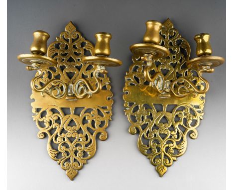 A pair of brass two light wall sconces, pierced cartouche shaped back plates [2]