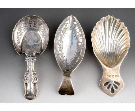A George III bright cut leaf shaped silver caddy spoon, hallmarked by William Pugh, Birmingham, 1810 together with a King's p