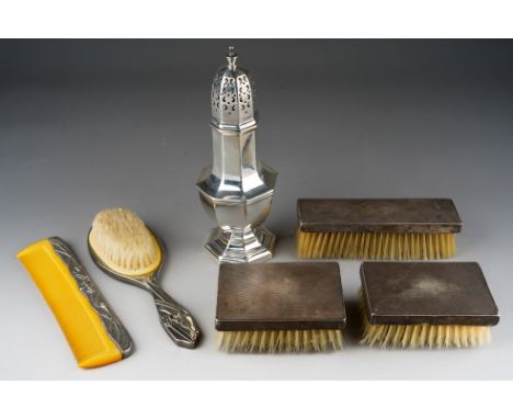 A set of three silver mounted Art Deco engine turned brushes, hallmarked London, 1936 together with a silver plated large cas