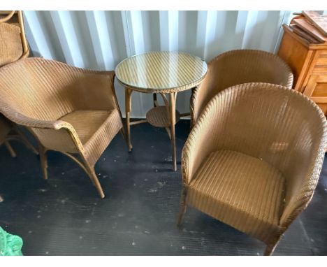 Lloyd Loom lusty bistro table with glass top and 3 chairs ( 1 larger and 2 smaller in size) in golden colour