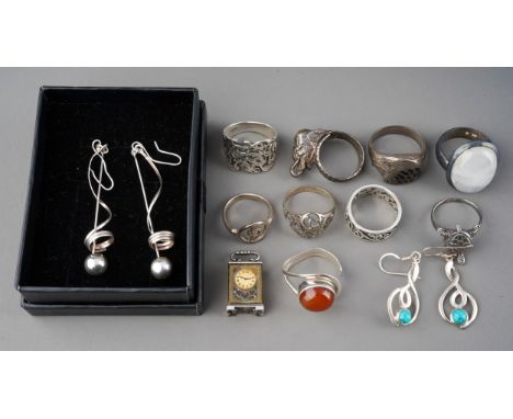 Collection of silver rings, earrings and a little carriage clock charm. Gross weight 72 g