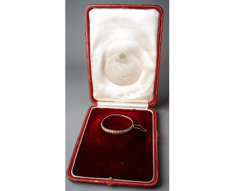 9ct gold bangle bracelet (9.6g) and a vintage leather Asprey of London necklace presentation case