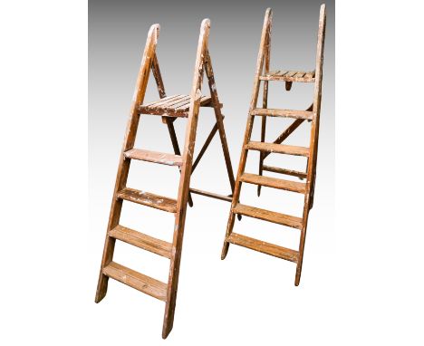 Two pair of folding wooden step ladders, one with four steps, the other with five (2)