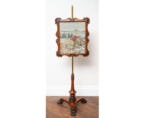 A Victorian mahogany pole fire screen, on tripod stand with brass back support, the rectangular screen with scroll border, ne