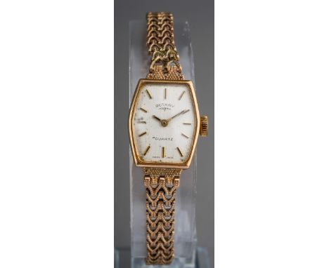 A 9ct gold Rotary quartz wristwatch. The silver tone dial, signed Rotary Quartz Swiss Made, to the textured bracelet, inner c