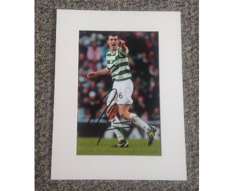 Football Roy Keane signed 16x12 mounted colour photo pictured while playing for Celtic in Scotland. Good Condition. All autog