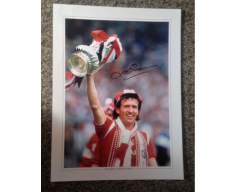 Football John Gidman signed 16x12 colour photo pictured while playing for Manchester United. Good Condition. All autographs a