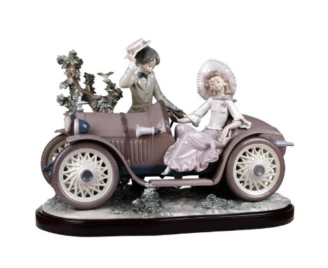 A large double signed Lladro porcelain figure group, 'First Date' the figure group modelled as a young lady, a gentleman, and