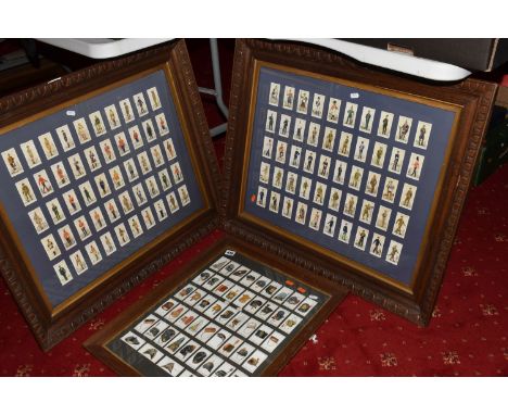 THREE FRAMED AND GLAZED DISPLAYS OF CIGARETTE CARDS FEATURING BRITISH ARMY UNIFORMS AND HEADDRESS, two of the frames feature 