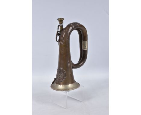 A GERMAN MILITARY BUGLE COMPLETE WITH BADGE, this is complete with mouthpiece and has two white metal bands on the handle, th