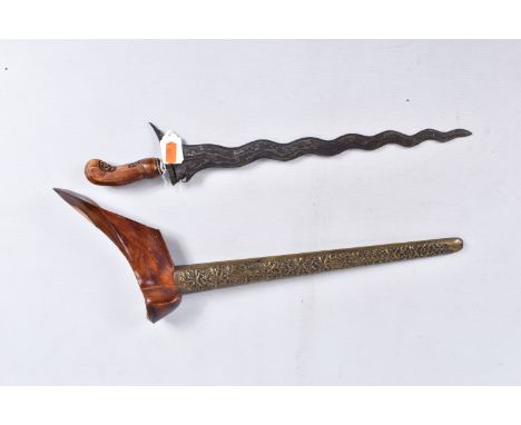 A TWENTIETH CENTURY ITRISS DAGGER WITH ORNATE SCABBARD, this features a carved wooden pommel and an ornate scabbard, it is in