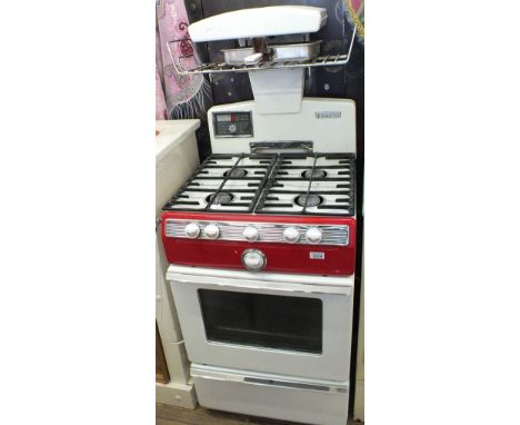A vintage cream and red Parkinson Cowen bottle gas cooker