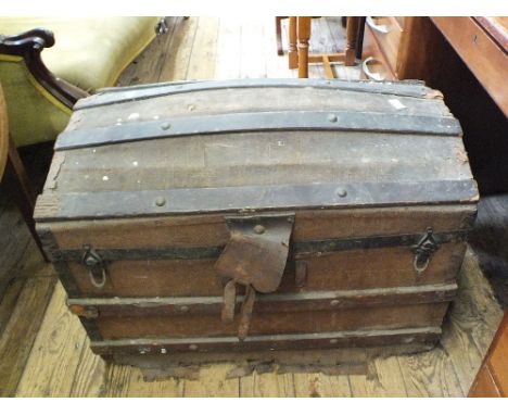 A Victorian metal bound dome top trunk