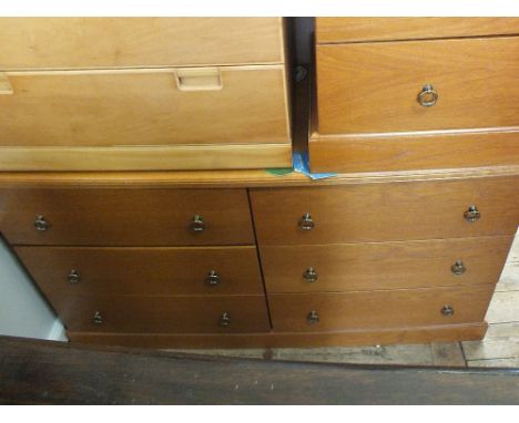 A modern light oak sideboard with six drawers and a matching bedside chest