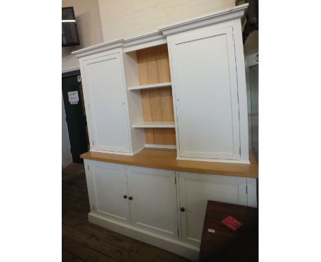 A part cream painted modern sideboard with shelf back and two cupboards above